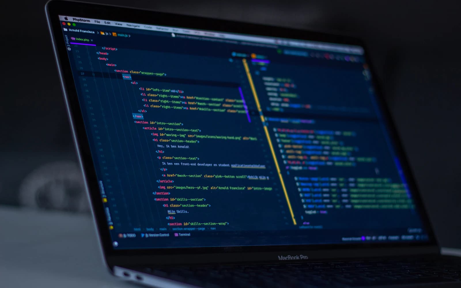 Custom software source code open on a laptop