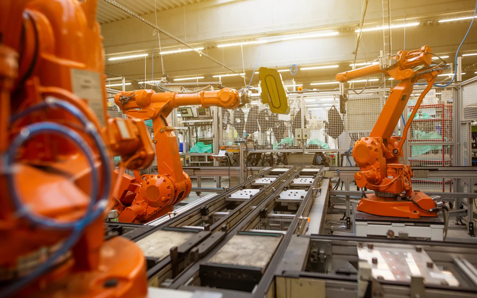 Robotic arms working on an automated production line